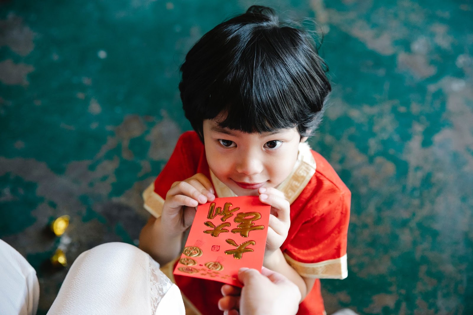 Gifting red envelopes containing money is a Chinese New Year tradition