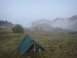 If your hike is overnight, you'll want "una carpa" with "un saco de dormir"