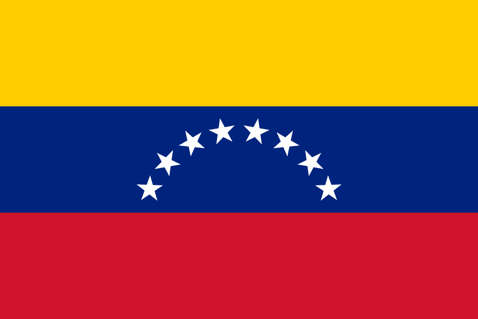 The Venezuelan flag with yellow, blue, and red horizontal stripes and eight white stars arcing across the center blue band.